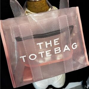 THE TOTE BAG in pink clear plastic. NWT